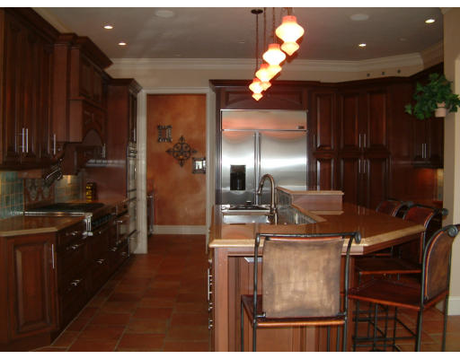 4 Shady Lane Walpole, MA 02081 - Photo 4 of 25 a kitchen with kitchen island granite countertop a sink cabinets and stainless steel appliances