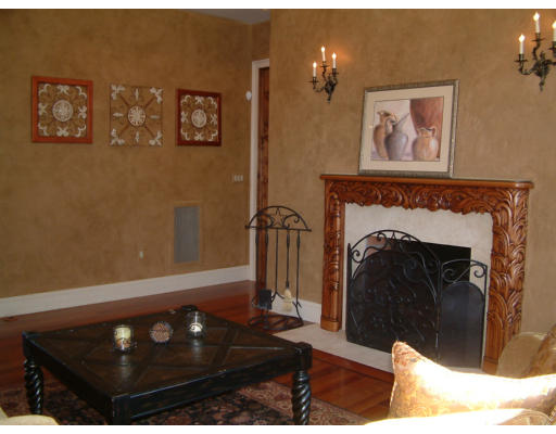 4 Shady Lane Walpole, MA 02081 - Photo 10 of 25 a view of a livingroom with furniture and a fireplace