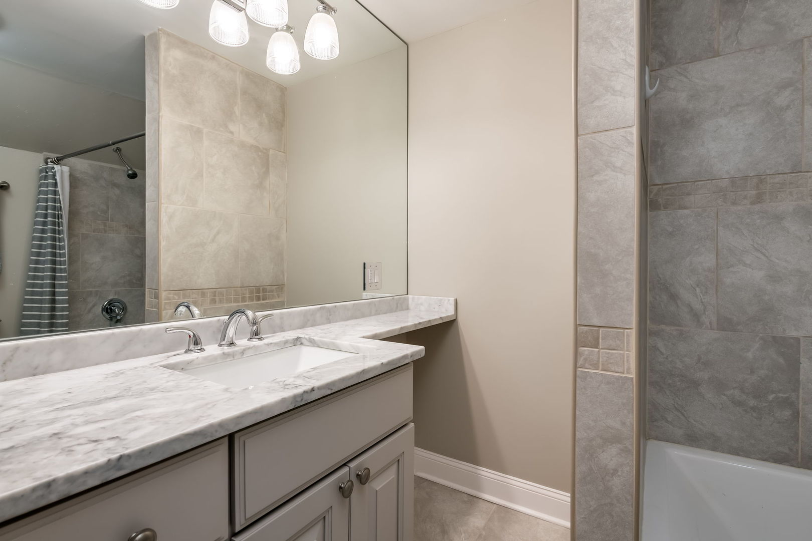 803 South Maple Avenue Oak Park, IL 60304 - Photo 17 of 31 a bathroom with a granite countertop sink and a mirror
