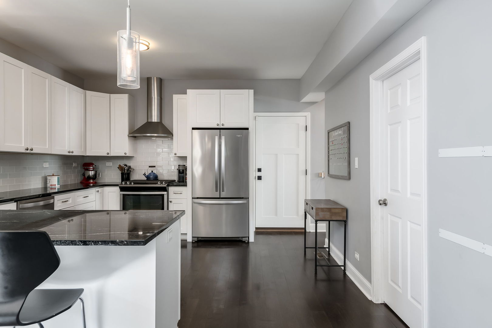 803 South Maple Avenue Oak Park, IL 60304 - Photo 10 of 31 a kitchen with stainless steel appliances a refrigerator a stove a sink dishwasher and a refrigerator with wooden floor