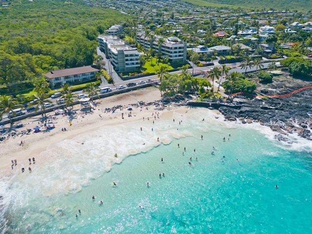 an aerial view of a beach with a yard
