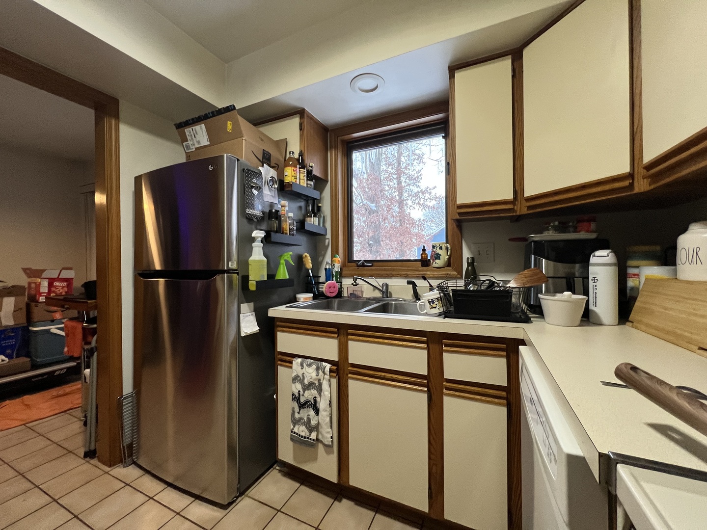 509 East Lake Avenue, Unit B Round Lake Beach, IL 60073 - Photo 8 of 18 a kitchen with stainless steel appliances granite countertop a refrigerator and a sink