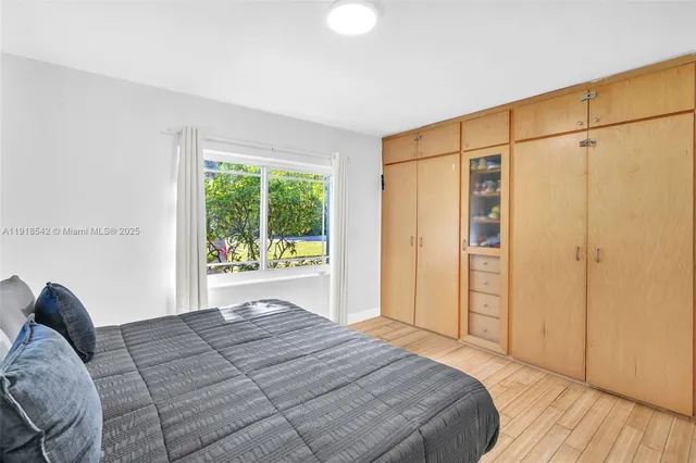 a bathroom with a bathtub sink and mirror