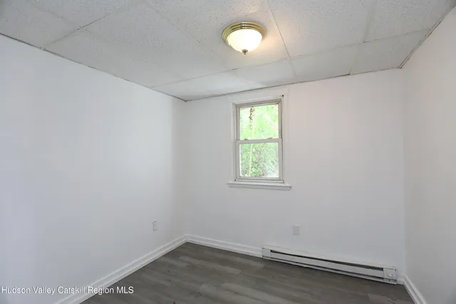 a kitchen with granite countertop a sink stove and refrigerator