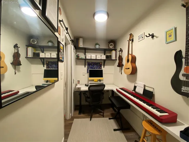 a room with furniture and gym equipment