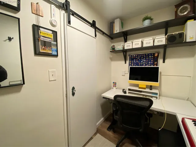 a view of a workspace with furniture