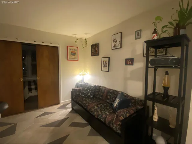 a living room with furniture and a window