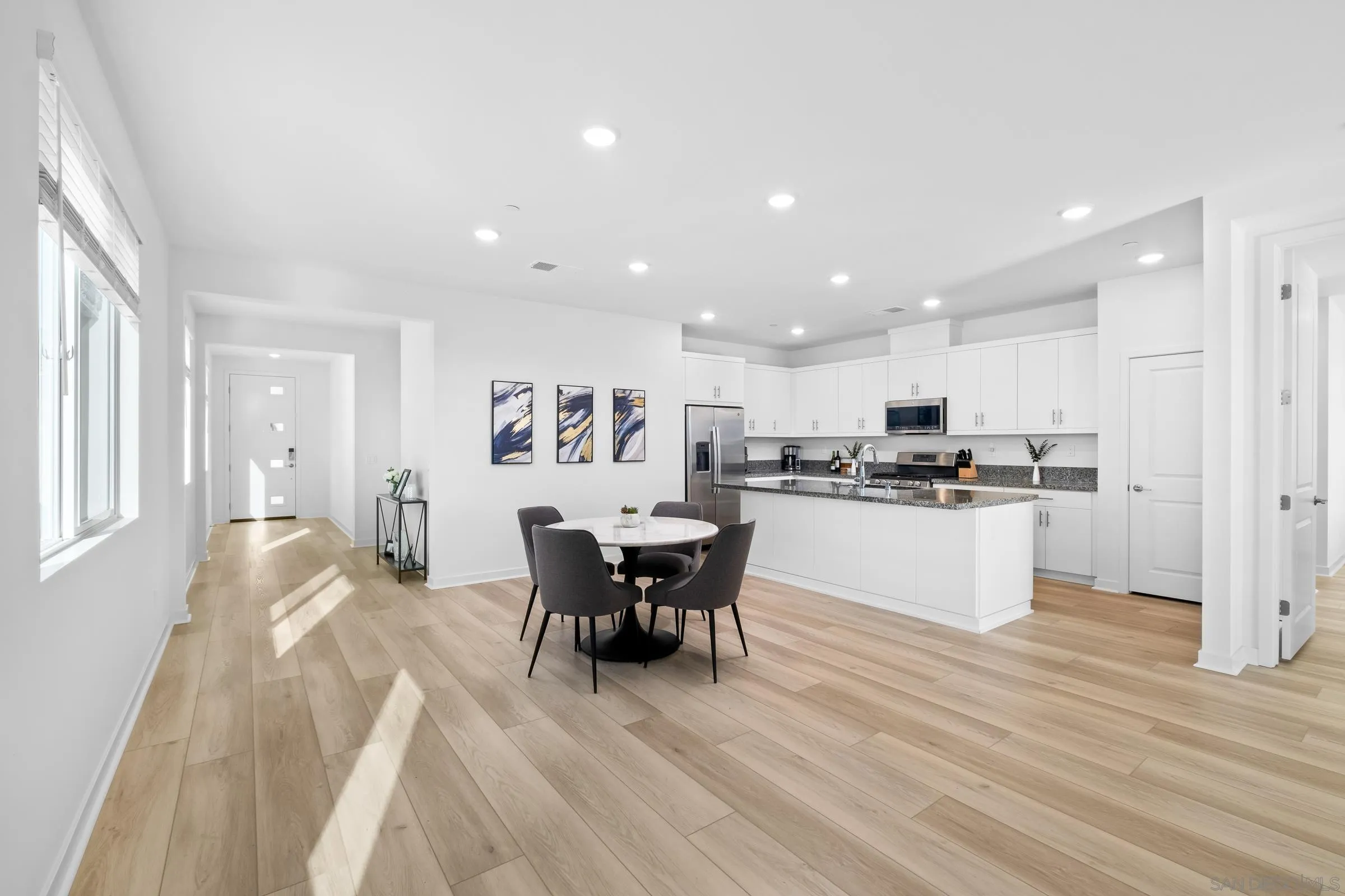 35164 Orchard Trail Fallbrook, CA 92028 - Photo 12 of 52 a kitchen with a table and chairs in it