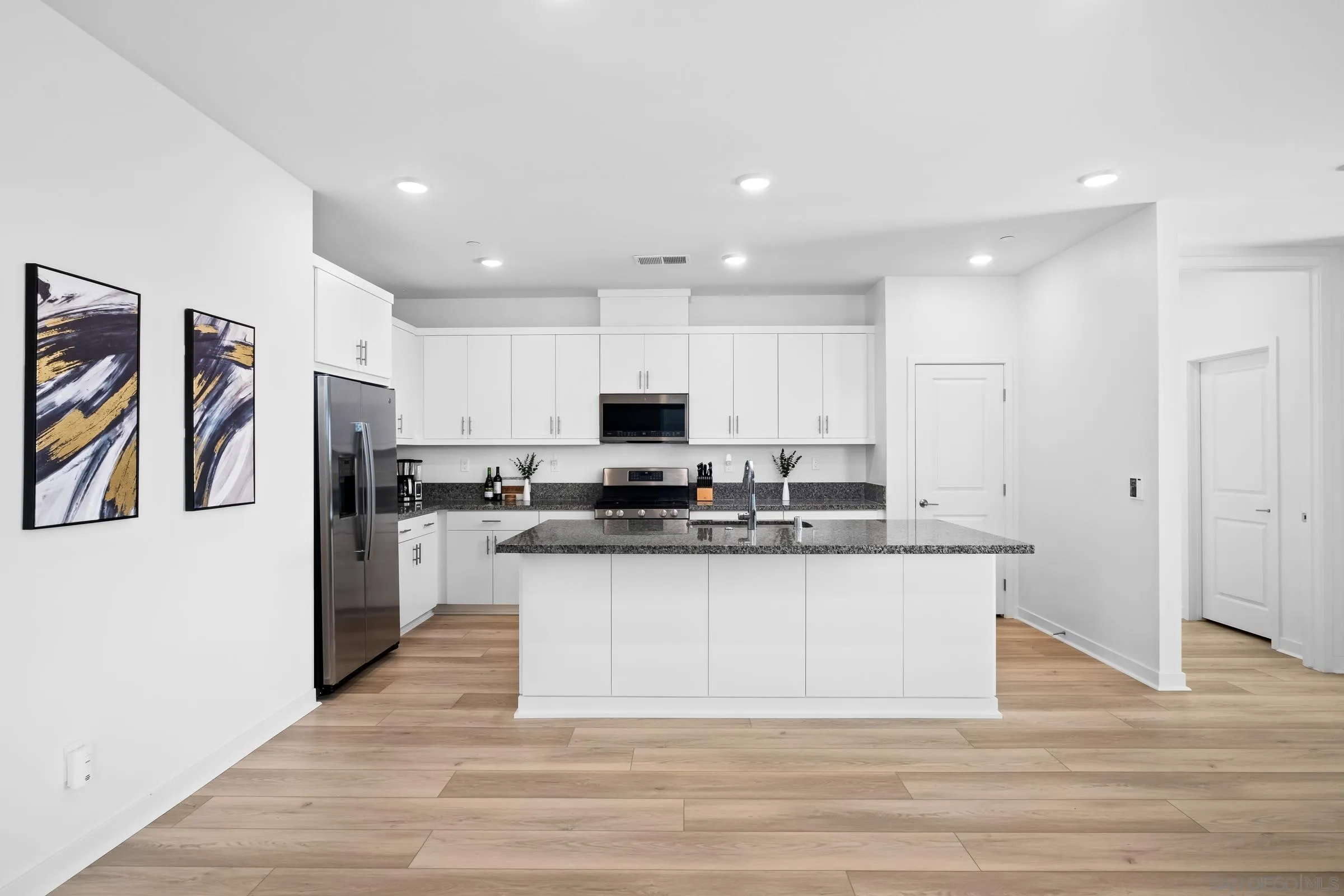 35164 Orchard Trail Fallbrook, CA 92028 - Photo 13 of 52 a kitchen with stainless steel appliances granite countertop a refrigerator and a stove top oven
