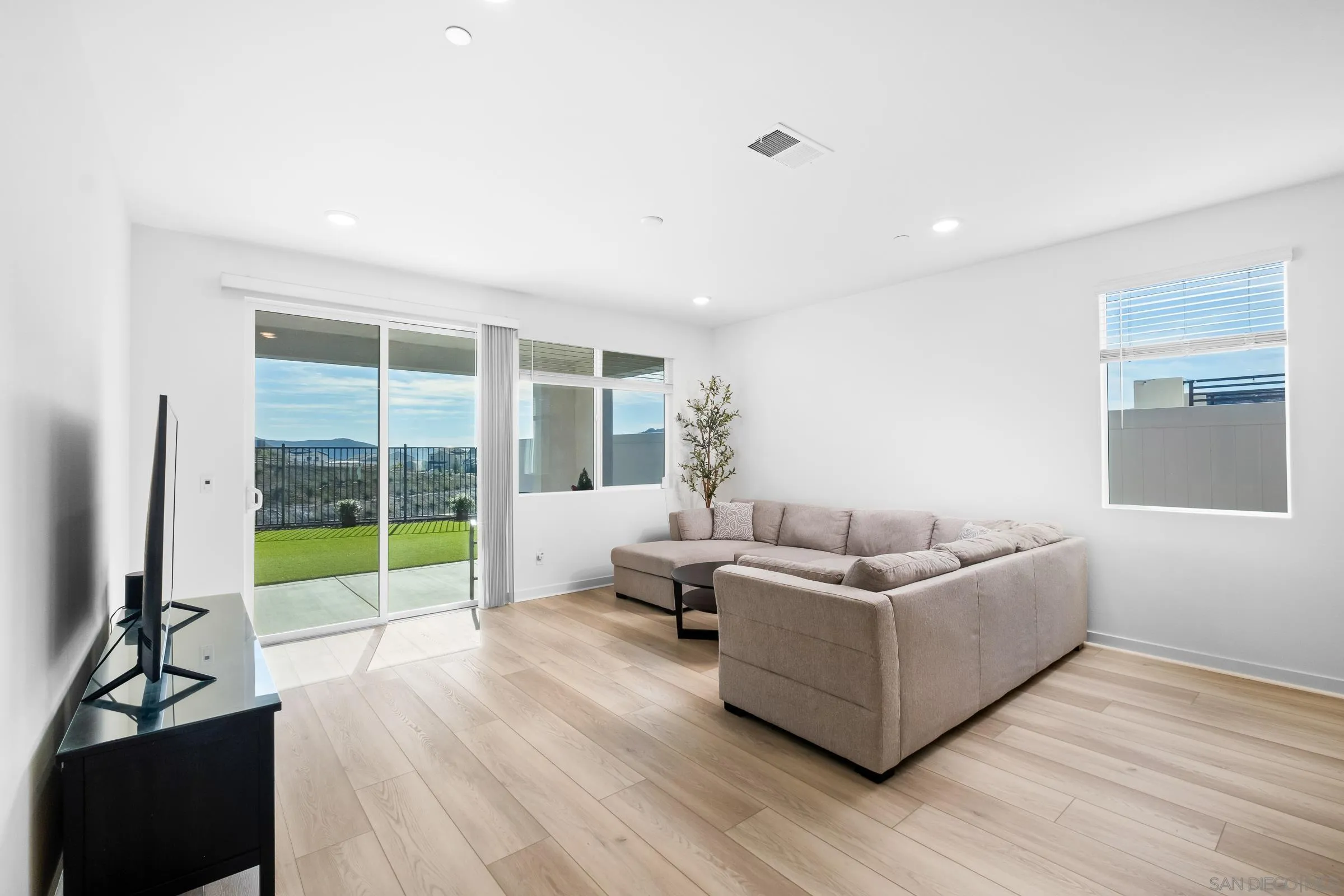 35164 Orchard Trail Fallbrook, CA 92028 - Photo 19 of 52 a living room with furniture and a flat screen tv