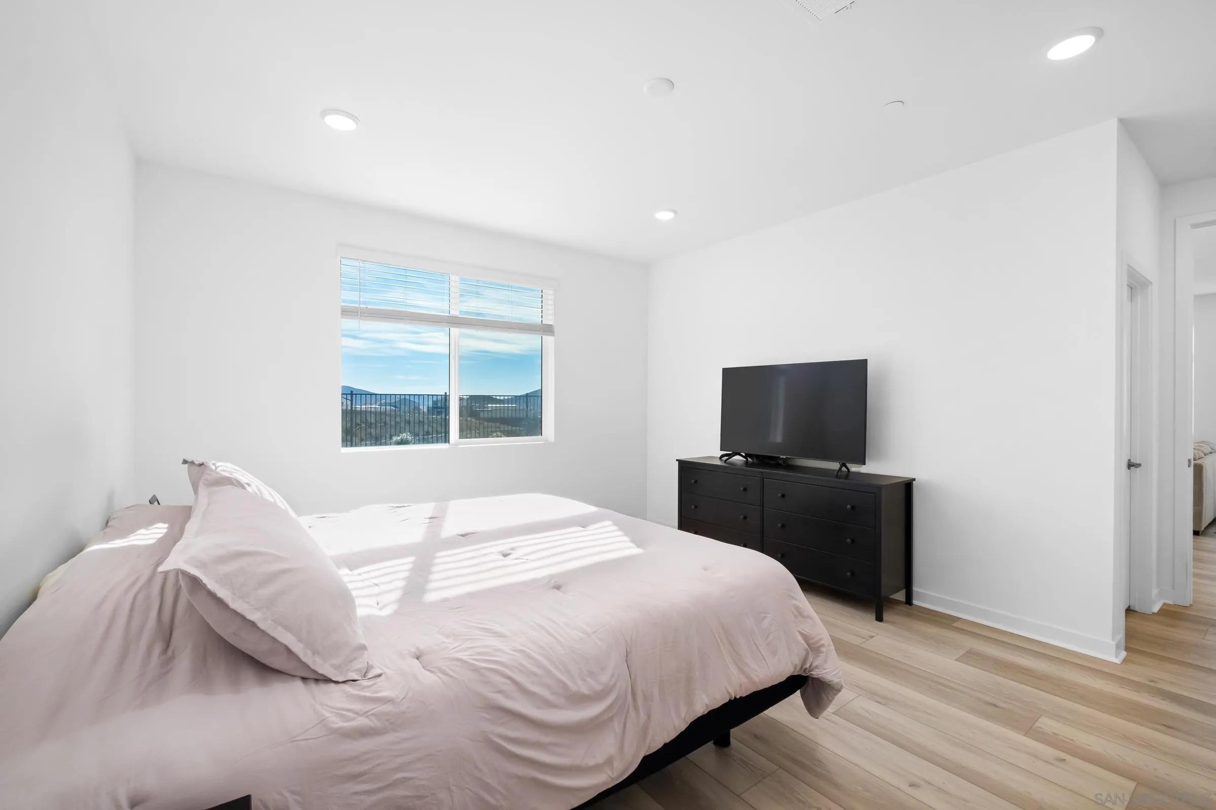 35164 Orchard Trail Fallbrook, CA 92028 - Photo 22 of 52 a bedroom with a bed and a television