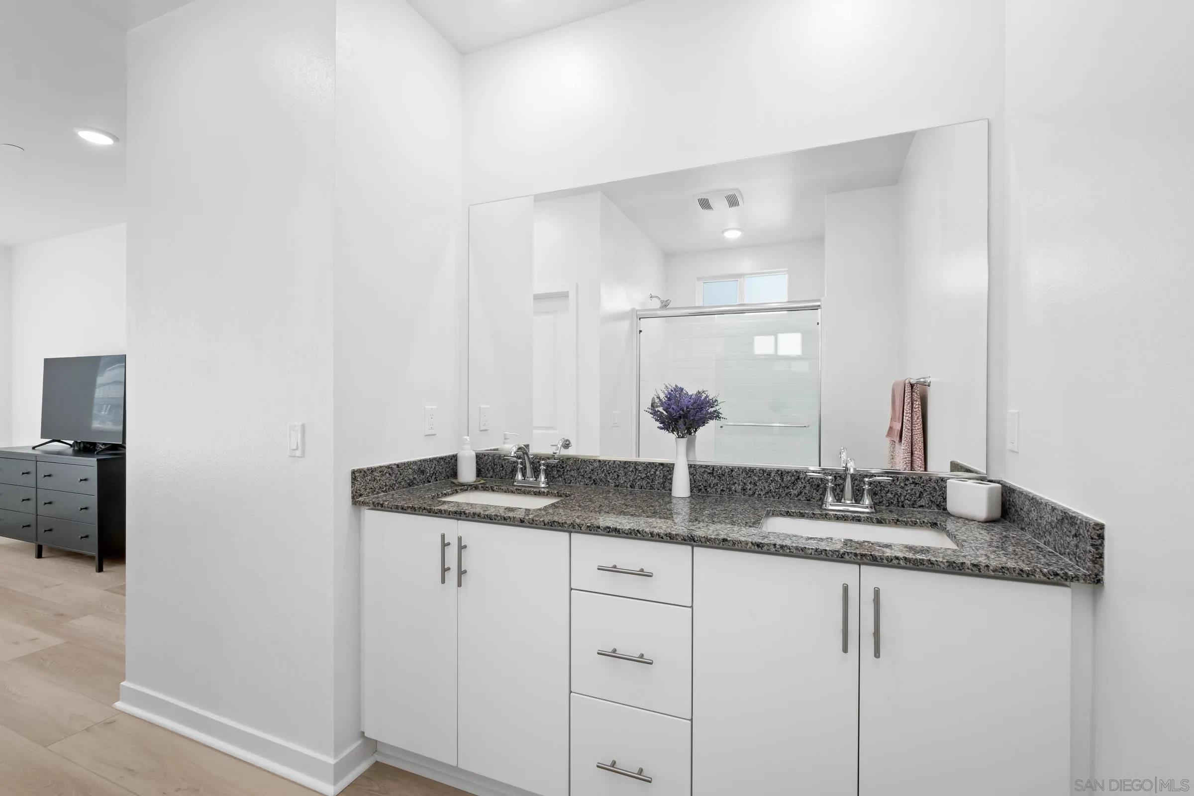 35164 Orchard Trail Fallbrook, CA 92028 - Photo 24 of 52 a bathroom with a granite countertop sink and a mirror