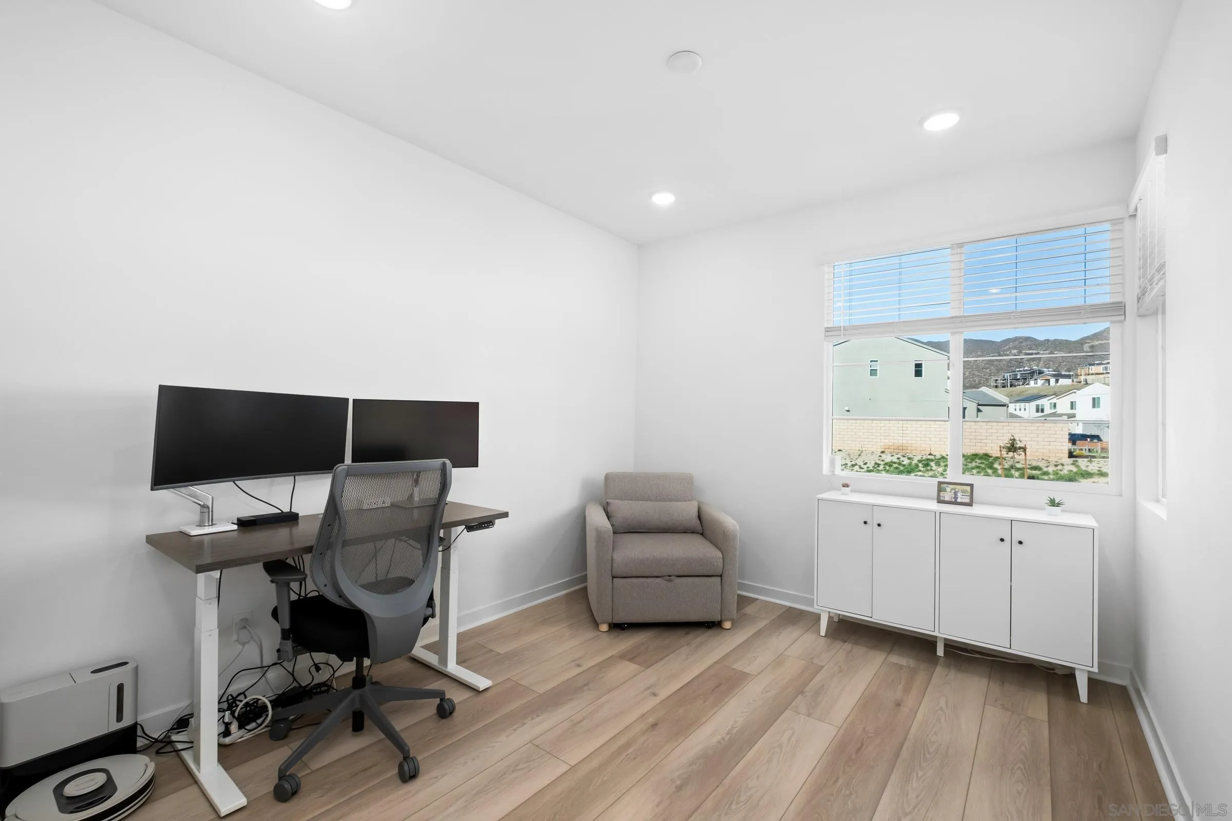 35164 Orchard Trail Fallbrook, CA 92028 - Photo 5 of 52 a view of workspace with wooden floor and white cabinet