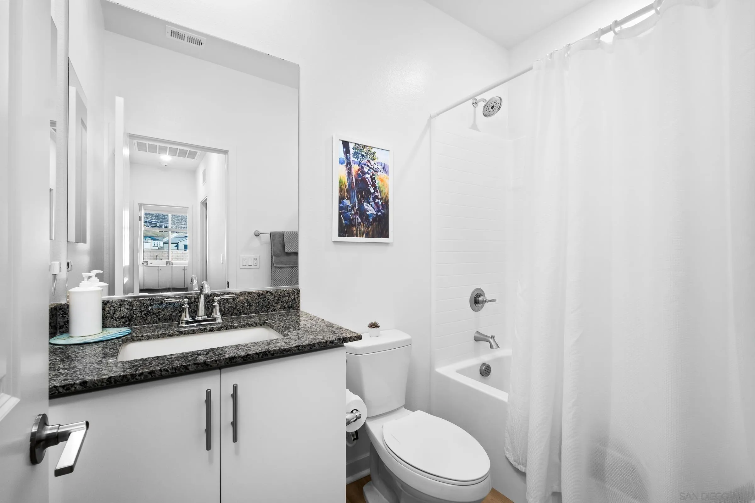 35164 Orchard Trail Fallbrook, CA 92028 - Photo 8 of 52 a bathroom with a granite countertop sink mirror vanity and toilet