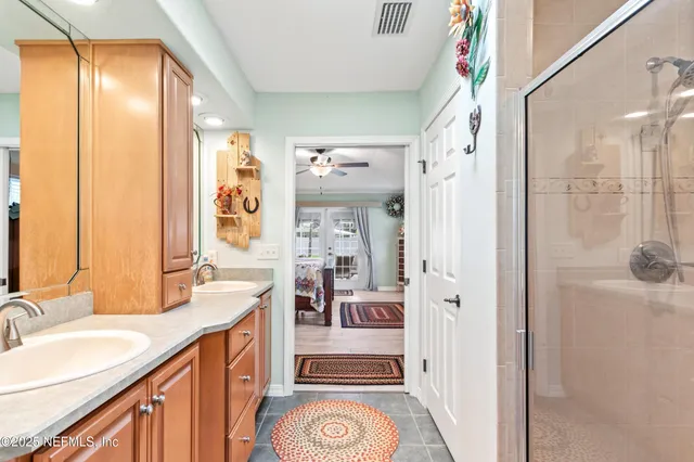 a bathroom with a shower and a mirror