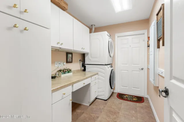 a bedroom with a bed and a mirror with the dresser
