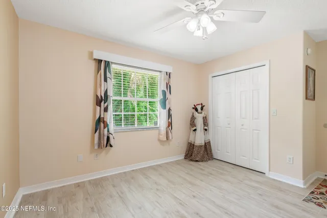 an outdoor space with swimming pool and furniture