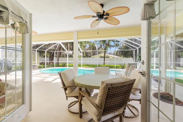 a view of a swimming pool with a patio