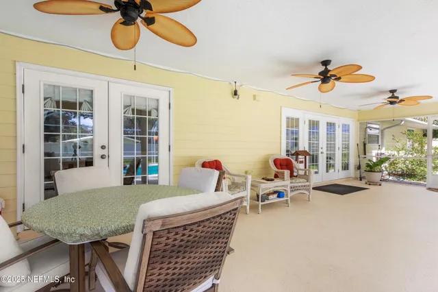 a view of a swimming pool with a garden and trees