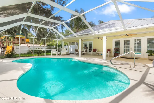 a view of green field with house in the background