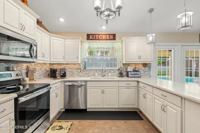 a kitchen with a sink cabinets and window