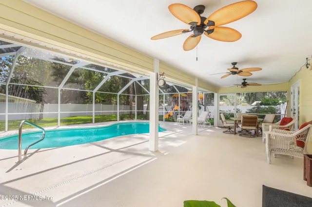 a view of a house with a yard and sitting area