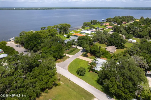 a view of a ocean with chairs
