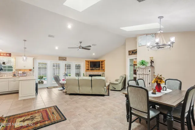 a spacious bedroom with a bed and a dresser in it