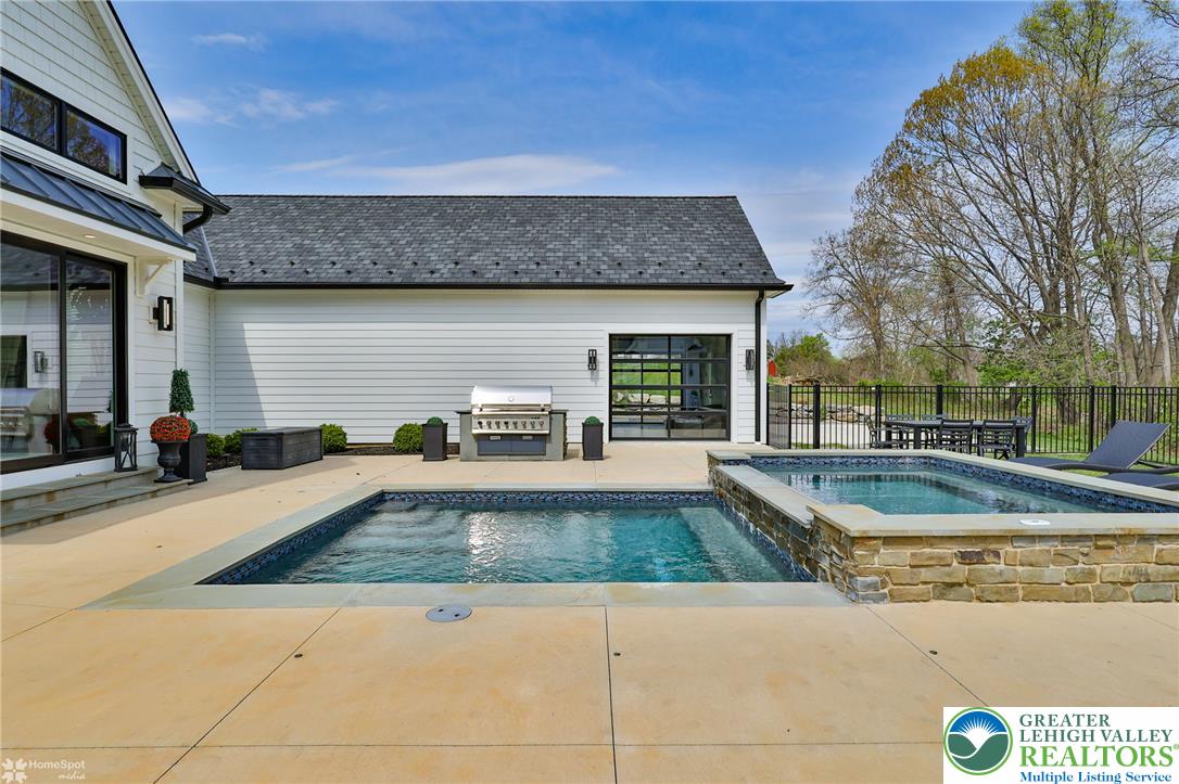 4850 West Hopewell Road Center Valley, PA 18034 - Photo 14 of 96 a view of a house with swimming pool