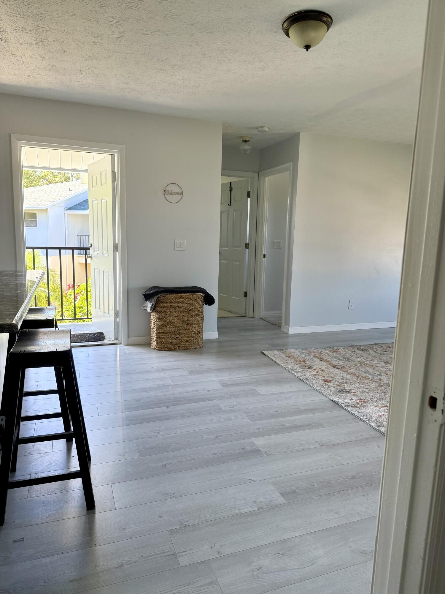 6537 Southeast Federal Highway, Unit 202 Stuart, FL 34997 - Photo 3 of 14 wooden floor in an empty room with a window