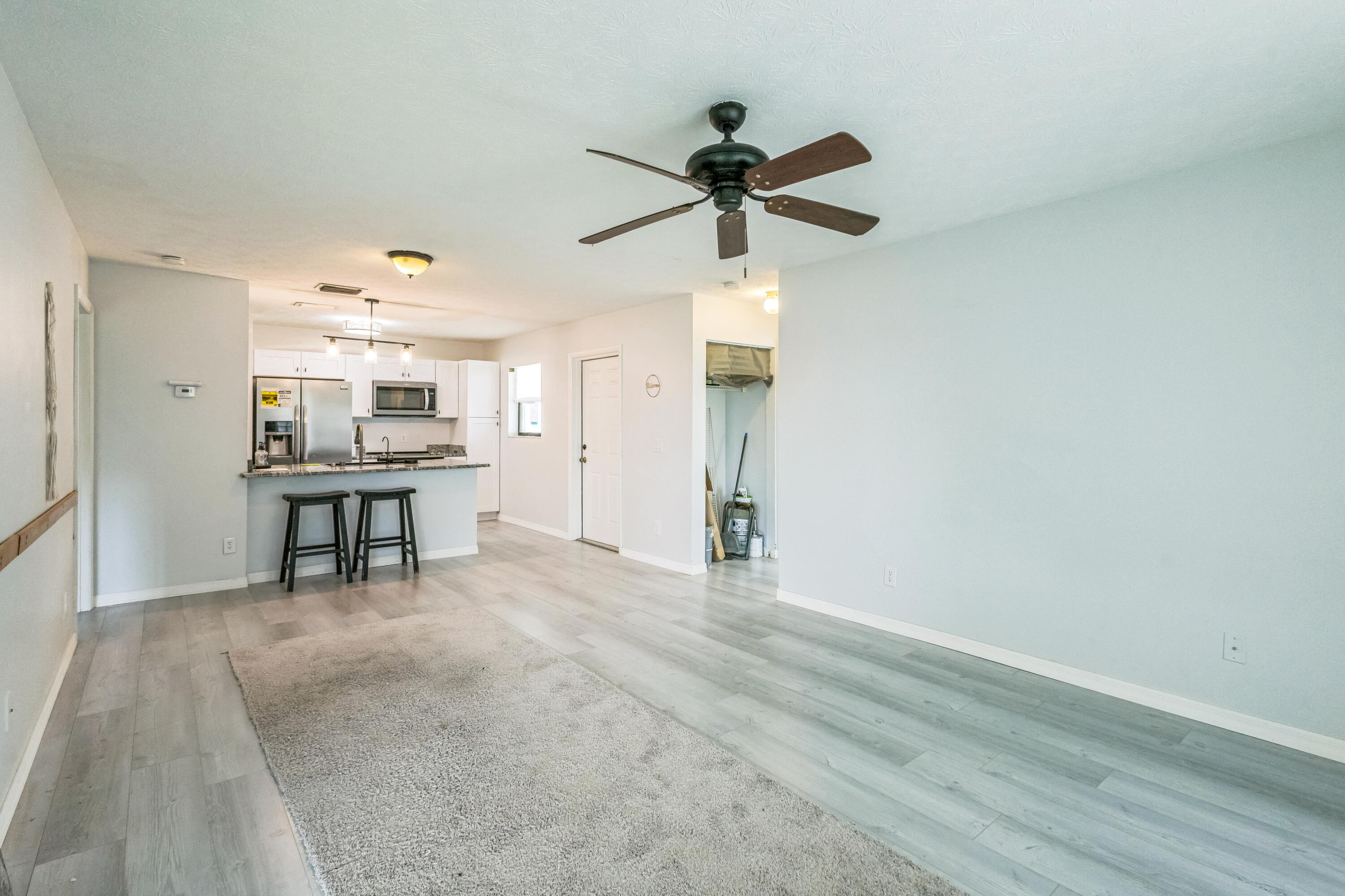 6537 Southeast Federal Highway, Unit 202 Stuart, FL 34997 - Photo 6 of 14 a view of an empty room and kitchen view