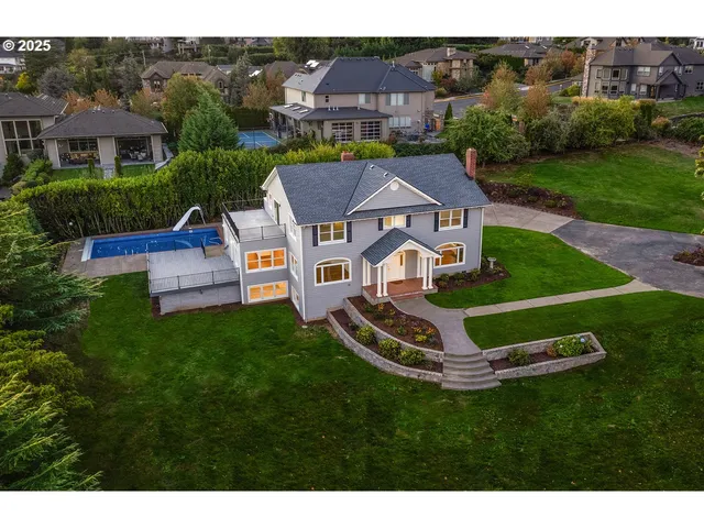 a aerial view of a house with a big yard