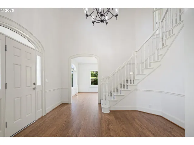 a view of entryway with wooden floor