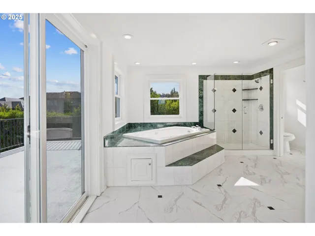 a bathroom with a sink a mirror and a shower