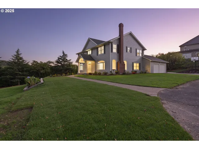 a view of a bench in the garden near a house