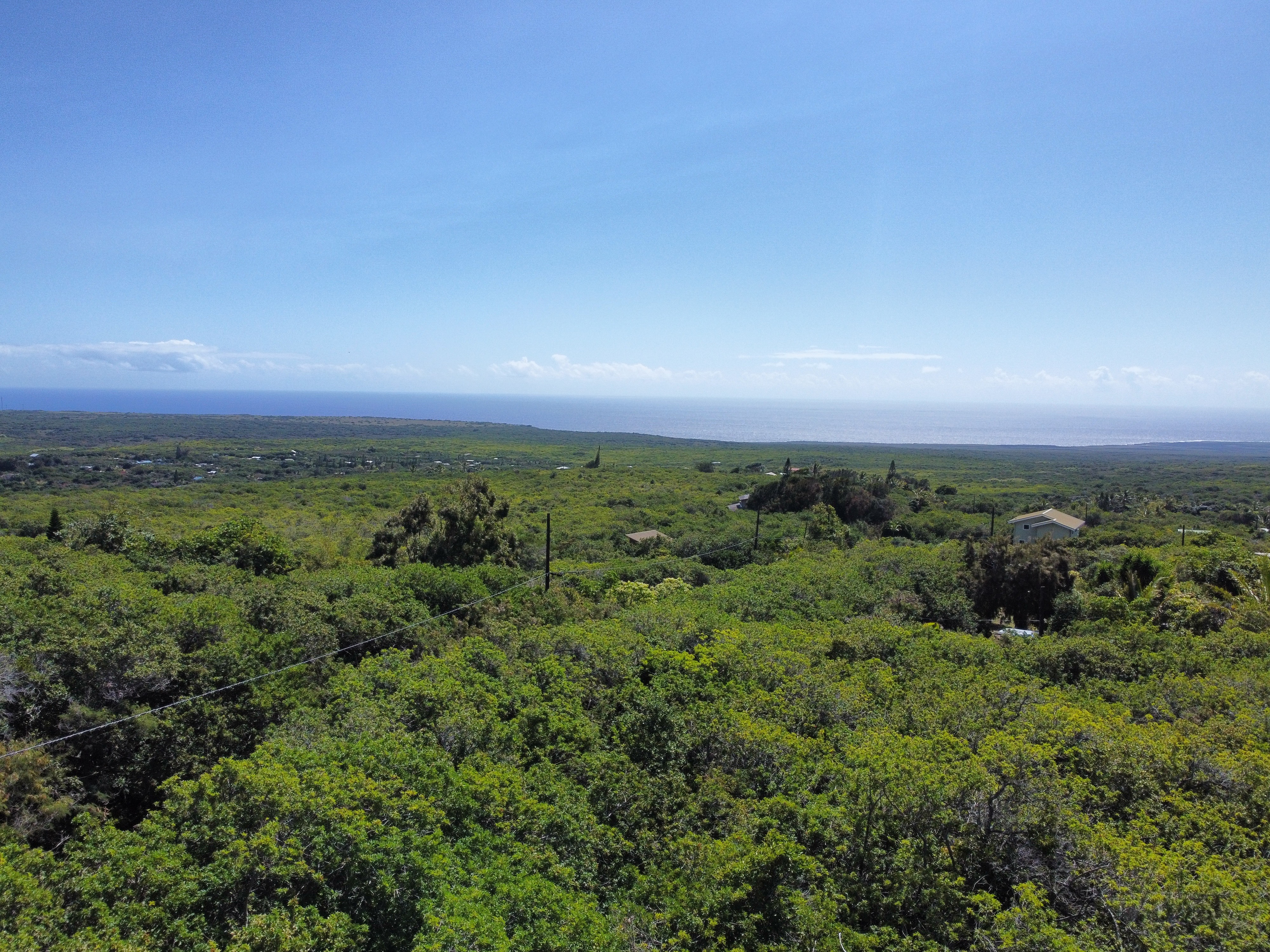 51 Lot 51 Palaoa Road Naalehu, HI 96772 - Photo 4 of 5 an aerial view of residential houses with outdoor space and trees