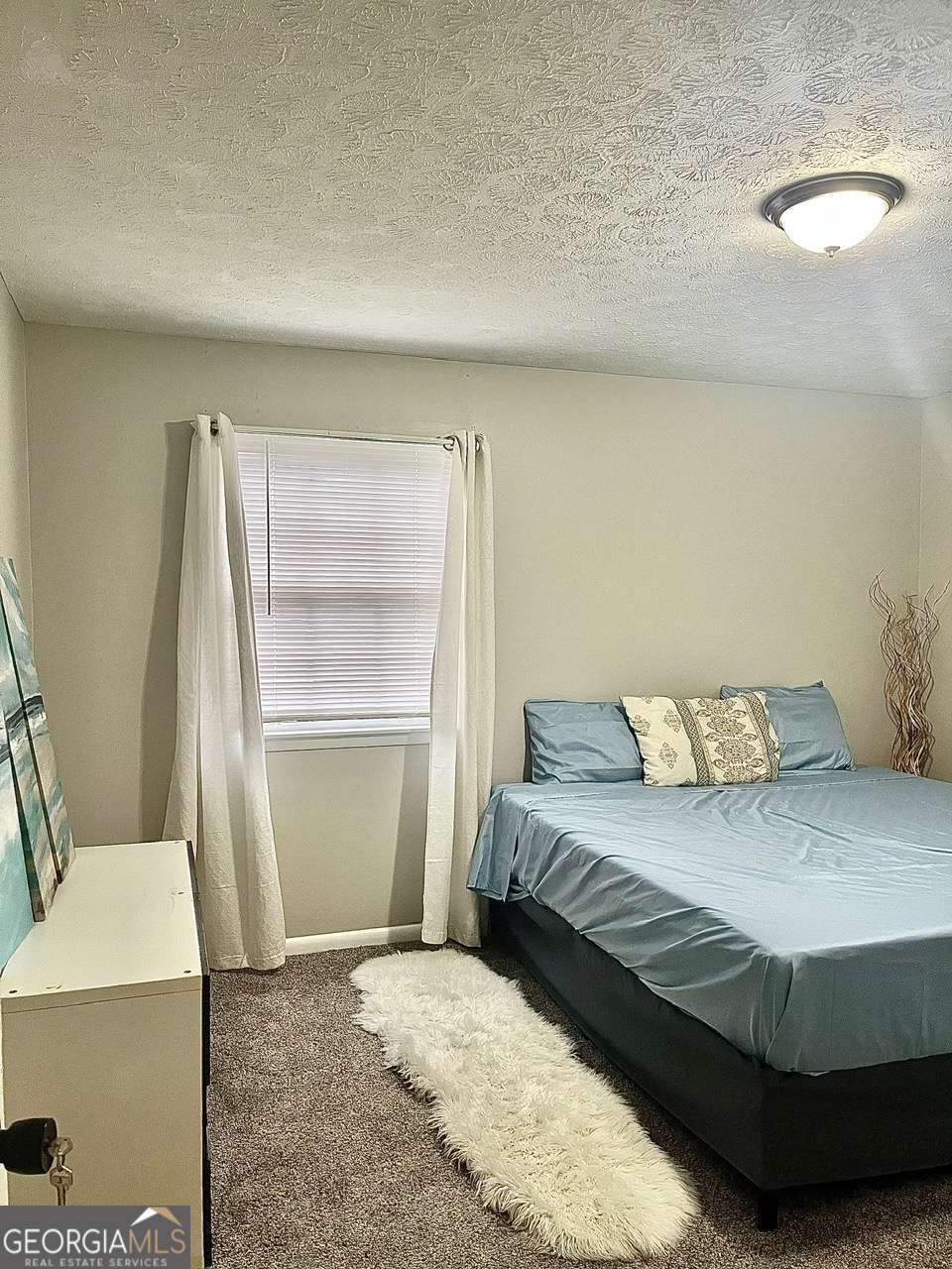 3608 Radcliffe Boulevard Decatur, GA 30034 - Photo 11 of 19 a bedroom with a bed and a walk in closet