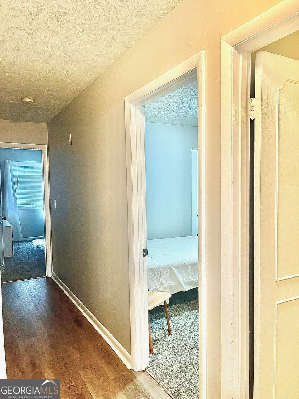 3608 Radcliffe Boulevard Decatur, GA 30034 - Photo 14 of 19 a view of a hallway with wooden floor and a bathroom