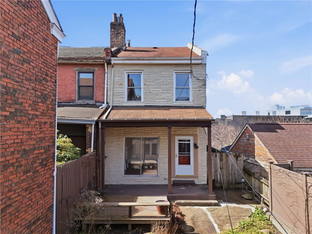 218 39th Street Pittsburgh, PA 15201 - Photo 1 of 24 a front view of a house with garden