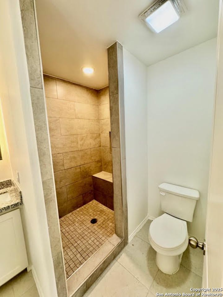 4031 Colibri Drive Laredo, TX 78046 - Photo 13 of 23 a bathroom with a toilet and a shower