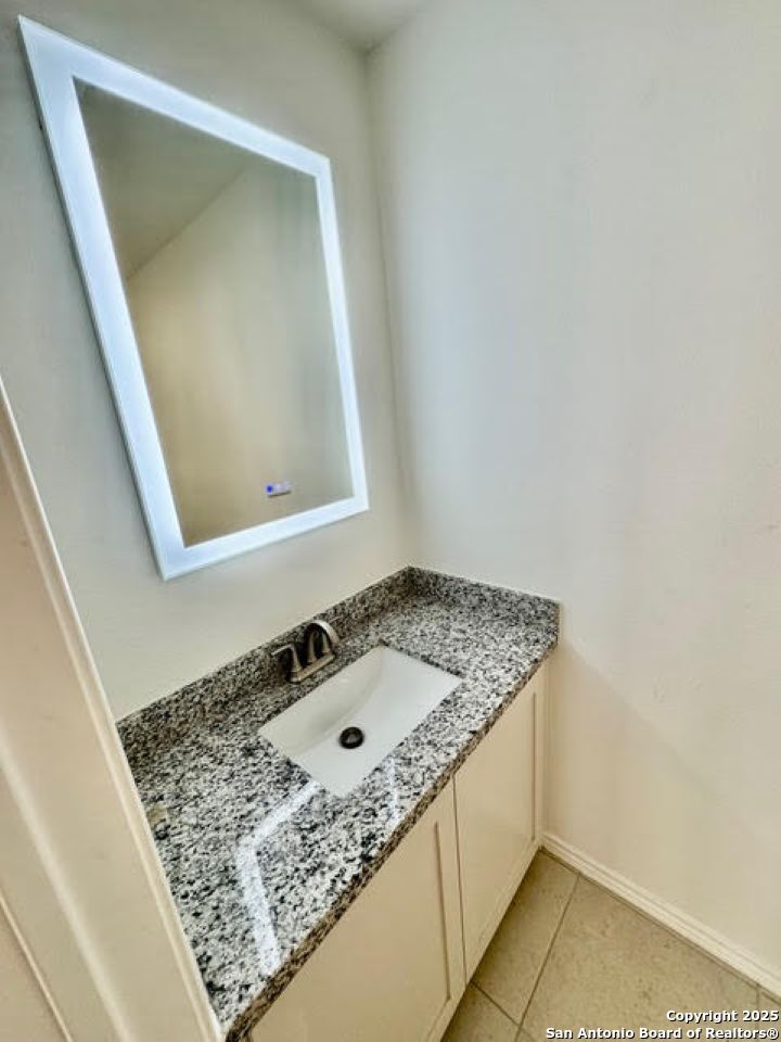 4031 Colibri Drive Laredo, TX 78046 - Photo 8 of 23 a bathroom with a sink and vanity