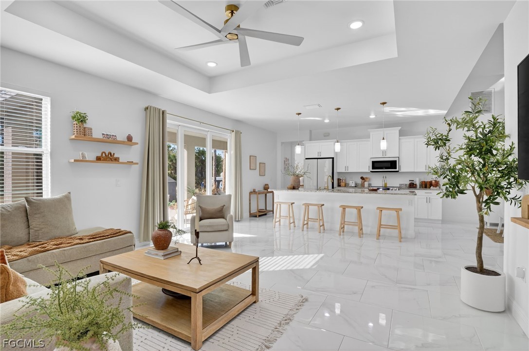 1207 Sheldon Avenue Lehigh Acres, FL 33972 - Photo 14 of 48 a living room with furniture and a large window