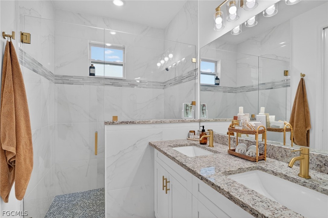 1207 Sheldon Avenue Lehigh Acres, FL 33972 - Photo 19 of 48 a kitchen with a sink a counter space and cabinets