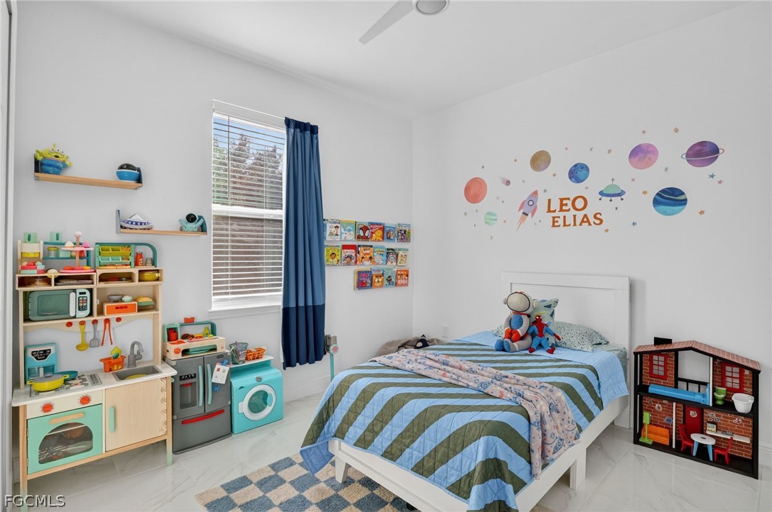 1207 Sheldon Avenue Lehigh Acres, FL 33972 - Photo 20 of 48 a bedroom with a bed and a window