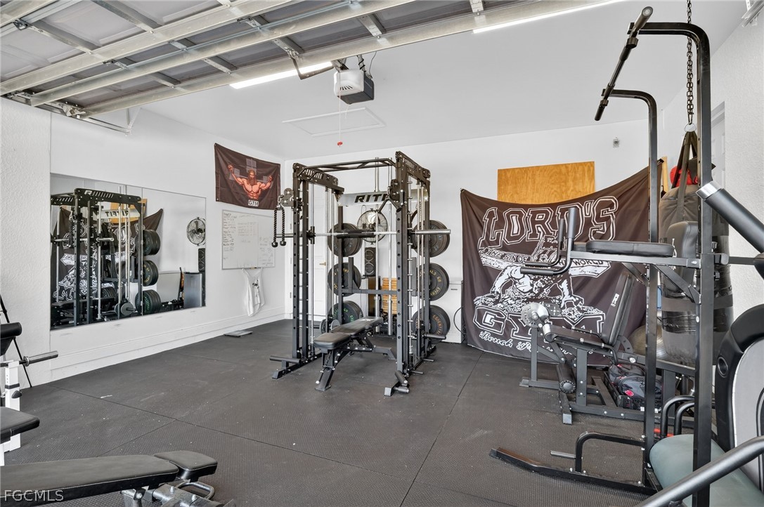 1207 Sheldon Avenue Lehigh Acres, FL 33972 - Photo 27 of 48 a view of a room with gym equipment