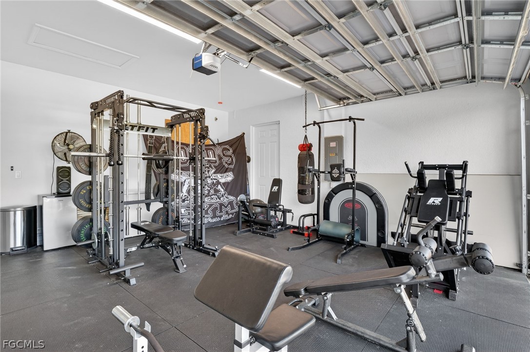 1207 Sheldon Avenue Lehigh Acres, FL 33972 - Photo 28 of 48 a view of a room with gym equipment