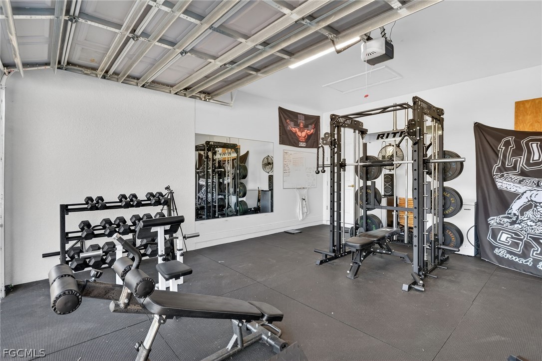 1207 Sheldon Avenue Lehigh Acres, FL 33972 - Photo 29 of 48 a view of a room with gym equipment