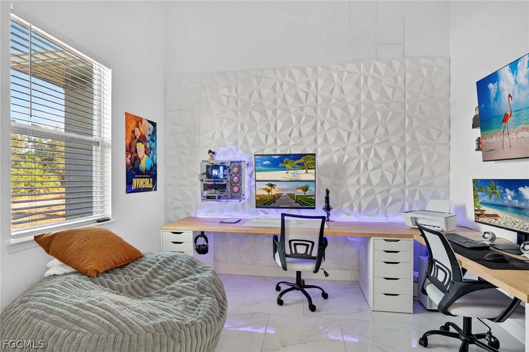 1207 Sheldon Avenue Lehigh Acres, FL 33972 - Photo 3 of 48 a bedroom with a workspace