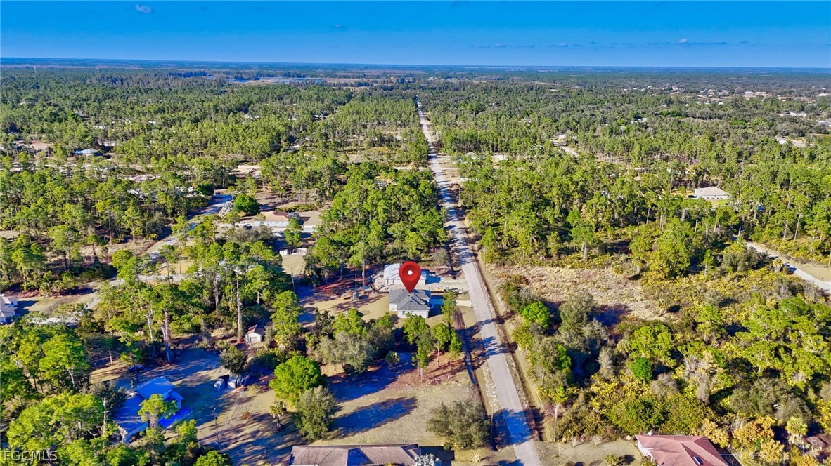 1207 Sheldon Avenue Lehigh Acres, FL 33972 - Photo 47 of 48 a view of a yard with an umbrella