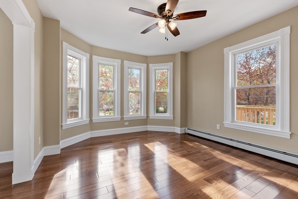 73 Cherry Street Gardner, MA 01440 - Photo 15 of 41 a view of empty room with wooden floor and fan